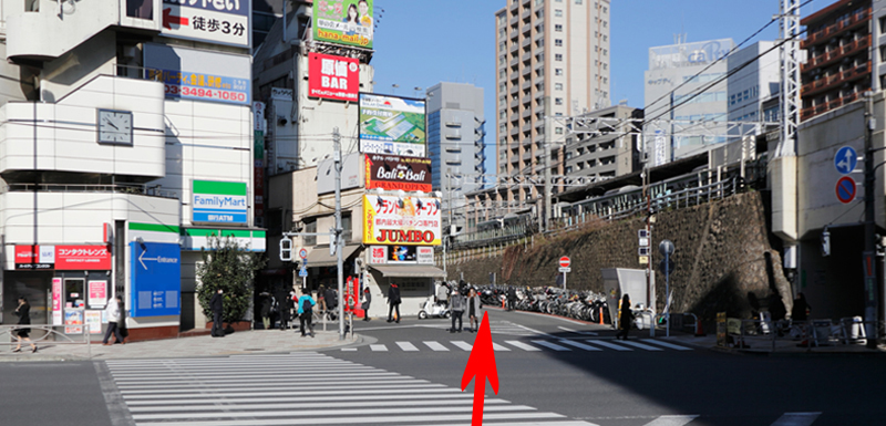 Go over the pedestrian crossing and follow the road along the railway line.